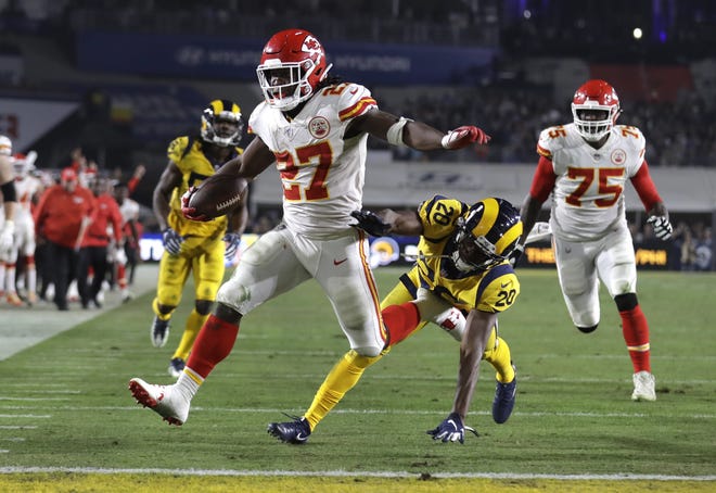 Former Chiefs running back Kareem Hunt (27) scores a touchdown Nov. 19 during an NFL football game between Kansas City and the Rams in Los Angeles. [Marcio Jose Sanchez/The Associated Press]