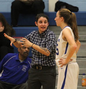 Middletown girls basketball assistant coach Alisa Benson, a former standout for the Islanders, talks to senior Erin Clancey during a recent game at the high school. [SCOTT BARRETT/DAILY NEWS PHOTO]