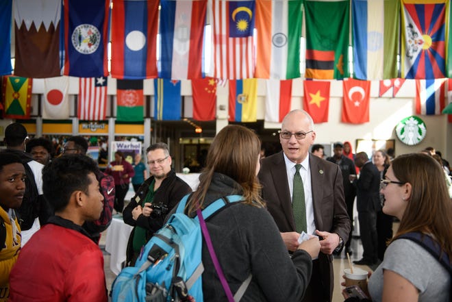 Methodist University President Stanley T. Wearden talks with students at the Berns Student Center at Methodist University on Friday, Feb. 15, 2019. [Andrew Craft/The Fayetteville Observer]