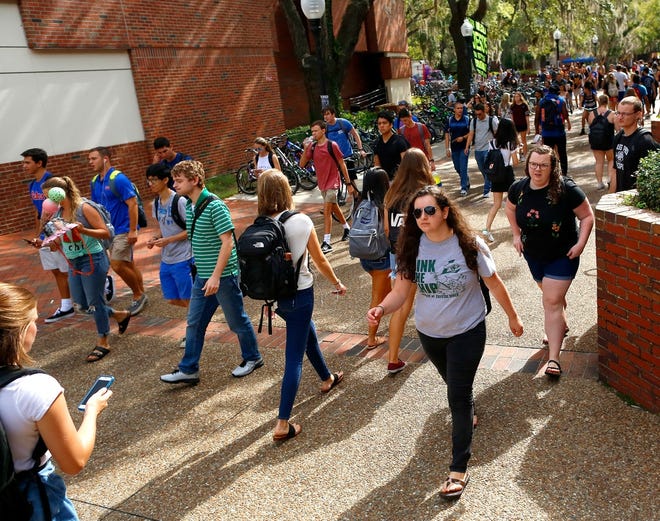 Students walk around the University of Florida campus on the first day of fall classes Aug. 21, 2018. Of the 14,136 admitted, UF officials expect to enroll about 6,550 of them for the 2023 class. [Brad McClenny/The Gainesville Sun]