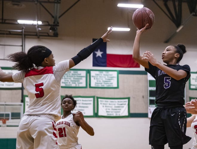 Cedar Ridge guard Jordyn Marshall, right, shoots over the head of Langham Creek guard Atlantis White during the Raiders' 60-50 bi-district win Monday. Cedar Ridge faces Klein Collins in a second-round playoff game Thursday in College Station. [John Gutierrez/for Statesman]