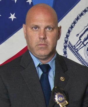 Det. Brian Simonsen is shown in this undated photo provided by the New York City Police Department. New York Police Commissioner James O'Neill told the media during a news conference that Simonsen was shot and killed by friendly fire Tuesday night, Feb. 12, 2019, while responding to a report of an armed robbery at a T-Mobile store in the Richmond Hill section of Queens. (New York City Police Department via AP)