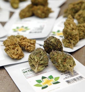 Cannabis flowers along with their packaging at CBD Plus USA in Oklahoma City last December. [Nate Billings/ The Oklahoman]
