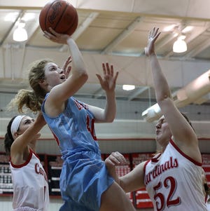 Zoe Johnson of Garaway drives for a layup as Baylee Offenberger and Abby Parker of Sandy Valley defend in the game at the Inter Valley Conference Showcase at Hiland. (TimesReporter.com / Jim Cummings)