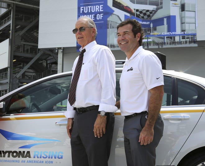 Then-NASCAR executive vice president Jim France, left, and then-Daytona International Speedway president Joie Chitwood III pose in Daytona Beach in 2015. France is running NASCAR the same way he lives his day-to-day life — quietly, in the background, away from the spotlight he never craved. [Joe Burbank/Orlando Sentinel via AP, File]