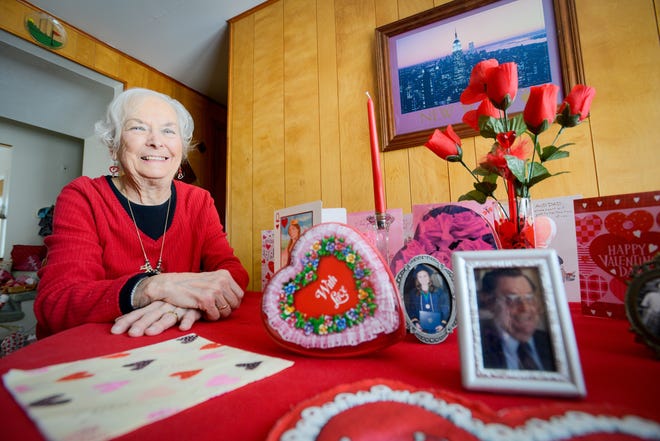 Utica resident June Taylor poses for a portrait in her home Wednesday, Feb. 13, 2019, next to Valentine's Day cards and decorations given to her from friends, family and her late husband, Gene. Gene passed away 17 years ago from a heart attack, but June still keeps Valentine's Day cards and presents from him and displays them for the holiday. She also participates in America's Greatest Heart Run & Walk every year, which helps raise awareness of heart health. [ALEX COOPER / OBSERVER-DISPATCH]