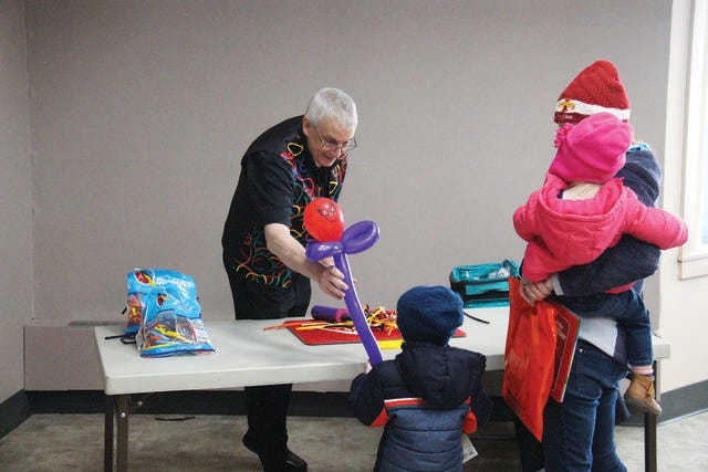 Children walked away with a balloon animal gift during the ‘Take Your Child to the Library Day’ event in 2018. FILE PHOTO/THE PERRY CHIEF