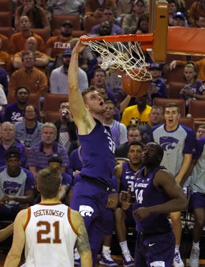 Kansas State senior forward Dean Wade, center, scored 12 points and had five rebounds and six assists in the No. 18-ranked Wildcats' 71-64 victory over Texas on Tuesday in Austin. [Michael Thomas/The Associated Press]