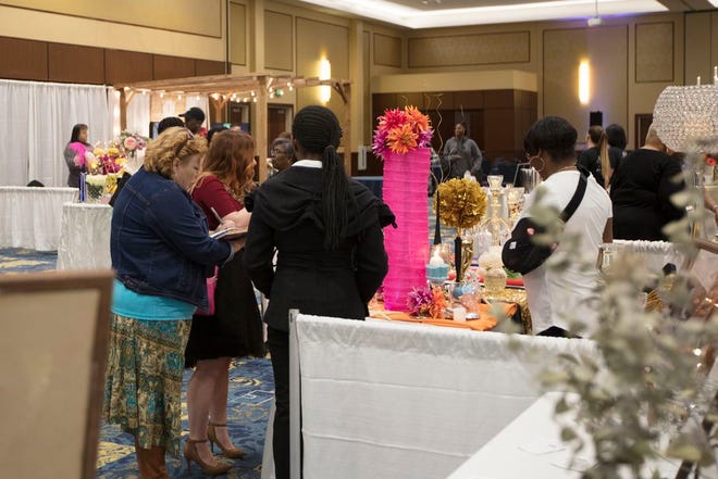 Guests talk to vendors at the Fort Bragg Wedding Expo, Saturday, at the Iron Mike Conference Center. The expo was a first for the venue.