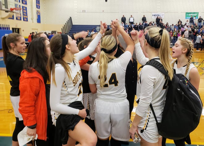 The South Side girls basketball team celebrates a 52-41 win over Riverview in the first round of the WPIAL Class 2A playoffs Friday at Hampton. [Andrew Chiappazzi/BCT Staff]