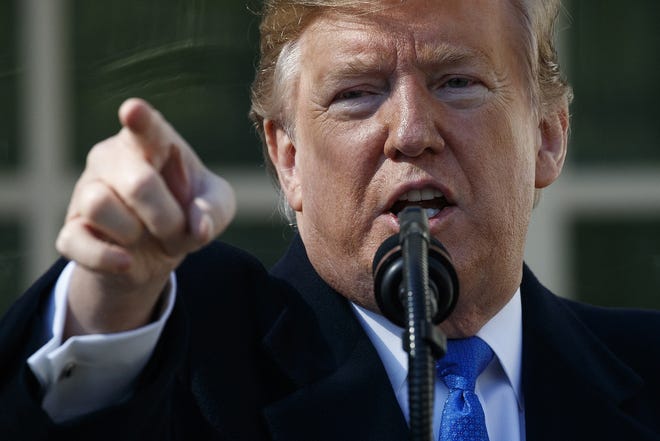 President Donald Trump speaks during an event in the Rose Garden at the White House to declare a national emergency in order to build a wall along the southern border Friday in Washington. [EVAN VUCCI/ASSOCIATED PRESS]