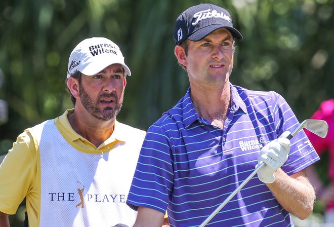 Paul Tesori (left) talks strategy with Webb Simpson during the 2018 Players Championship, which Simpson won by four shots. Tesori won his fifth Florida State Golf Association Winter Series Mid-Amateur title last week in Daytona Beach. [Gary Lloyd McCullough/For the Times-Union]
