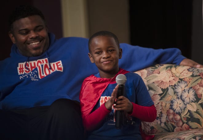 Austin Perine, 5, and his dad, T.J., attend the Show Love Fest on Feb. 10 in Gaithersburg, Maryland. Austin came up with the Show Love campaign as a way of helping feed homeless people. He travels around the country to raise money and raise awareness of homelessness. [Marvin Joseph/The Washington Post]