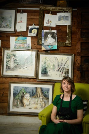 Artist Katie Crawford sits in her studio in Haymount, where she builds an enchanting world populated by mice, hedgehogs, turtles and frogs. [Andrew Craft/The Fayetteville Observer]