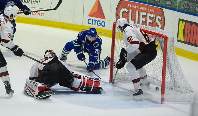 Tom Pyatt pushes in the game-winning goal late in overtime to help the Utica Comets top the Cleveland Monsters 5-4 in overtime on Sunday in Utica. [Lindsay A. Mogle / Utica Comets]