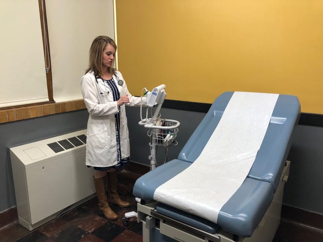 Nurse practitioner Jessica Nichols gives a tour of the new Topeka High Campus Care health clinic, which is a partnership between the school and The University of Kansas Health System. [Linda Ditch/Special to The Capital-Journal]