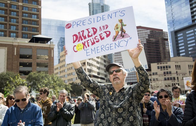 Pete Fredriksen, 67, of Austin, was among the people who protested Monday at Republic Square Park against President Donald Trump's national emergency declaration. [ANA RAMIREZ/AMERICAN-STATESMAN]