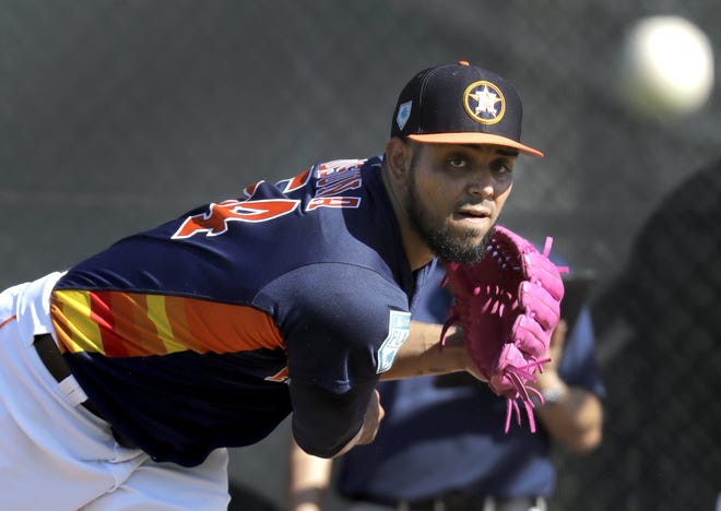 Houston Astros pitcher Roberto Osuna throws a bullpen session during spring training baseball practice Friday. Manager A.J. Hinch announced that Osuna will close games for the club this year. [AP Photo/Jeff Roberson]