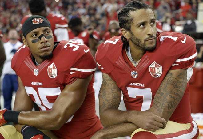 FILE - In this Sept. 12, 2016, file photo, San Francisco 49ers safety Eric Reid (35) and quarterback Colin Kaepernick (7) kneel during the national anthem before an NFL football game against the Los Angeles Rams in Santa Clara, Calif. Kaepernick and Reid have reached settlements on their collusion lawsuits against the NFL.[MARCIO JOSE SANCHEZ/THE ASSOCIATED PRESS]