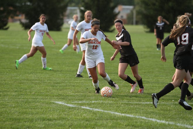 Pennsbury High School girls soccer players (white uniforms) compete against Boyertown Area in a recent game. Pennsbury was one of several area high schools to have their athletic programs honored as among the best in the state by Niche.com. [CONTRIBUTED]