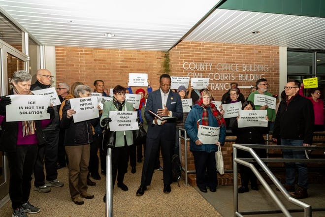 Members of the Alamance County NAACP demonstrate Monday night, Feb. 18, before the county commissioners meeting. Curtis Gatewood, Alamance NAACP president, was arrested when he would not stop speaking at the end of the meeting's public comments period.