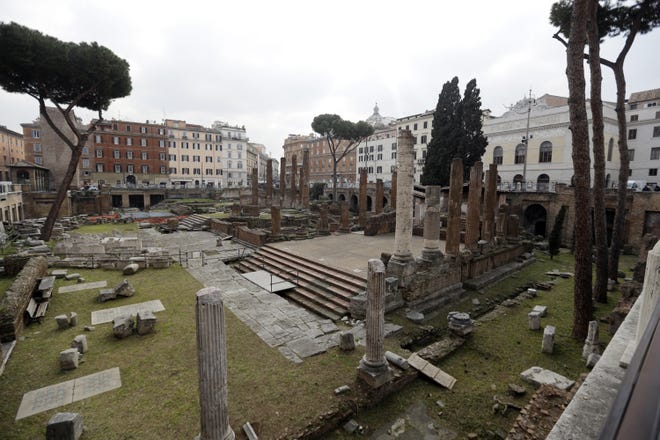 A view of the archeological site of Largo Argentina, in Rome, Monday, Feb. 18, 2019. A complex of ancient temples linked to Julius Caesar's murder will be opened to the public. The below-street-level temple ruins at Largo Argentina in the heart of downtown Rome is visible to pedestrians. But Rome's mayor said Monday by late 2021, walkways will be constructed inside the site so that tourists can stroll through the ruins. Bulgari luxury goods maker is sponsoring the work. The area includes a stone podium that was part of the senate-meeting place where Caesar was slain in 44 B.C. [AP Photo/Gregorio Borgia]
