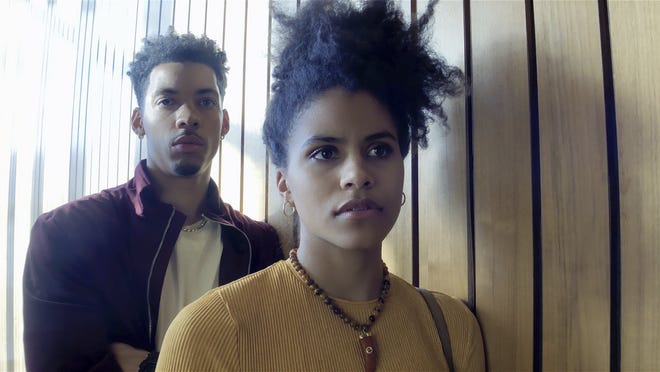 Melvin Gregg, left, and Zazie Beetz in a scene from "High Flying Bird." [Contributed by Peter Andrews/Netflix via AP]