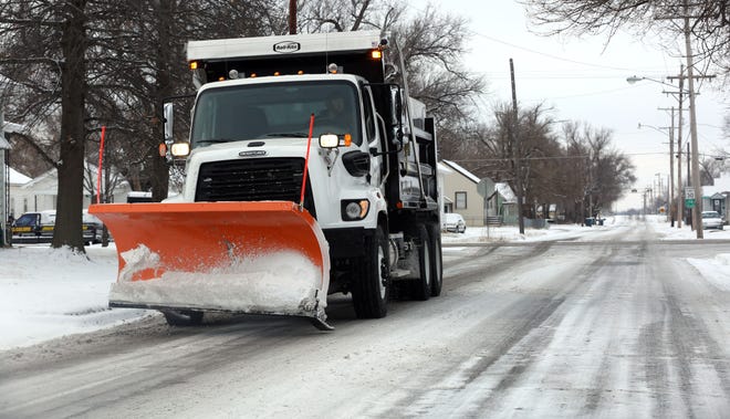 A City of Hutchinson snow plows drives along Severance St. Monday morning, Feb. 16, 2015 after a snowstorm left 1 1/2 inches of snow in the Hutchinson area. A chance of more snow and possibly some rain have been forecast for Tuesday. [File/HutchNews]