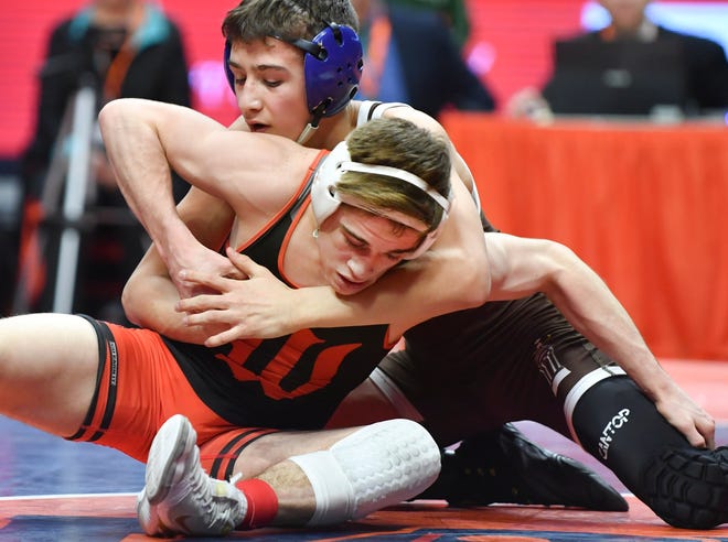 RON JOHNSON/JOURNAL STAR Brody Norman of Washington, is controlled by Dean Hamiti of Joliet Catholic during their 126 lb title match in Class 2A of the IHSA individual state wrestling finals in Champaign on Saturday. Norman took second place.
