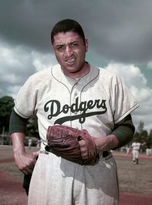 Don Newcombe, the hard-throwing Brooklyn Dodgers pitcher who was one of the first black players in the major leagues and who went on to win the rookie of the year, Most Valuable Player and Cy Young awards, died Tuesday at 92. [The Associated Press]