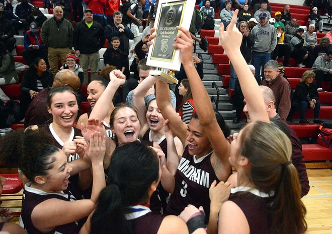 Windham players celebrate their ECC Division II Championship win over Montville on Tuesday at NFA. [John Shishmanian/ NorwichBulletin.com]