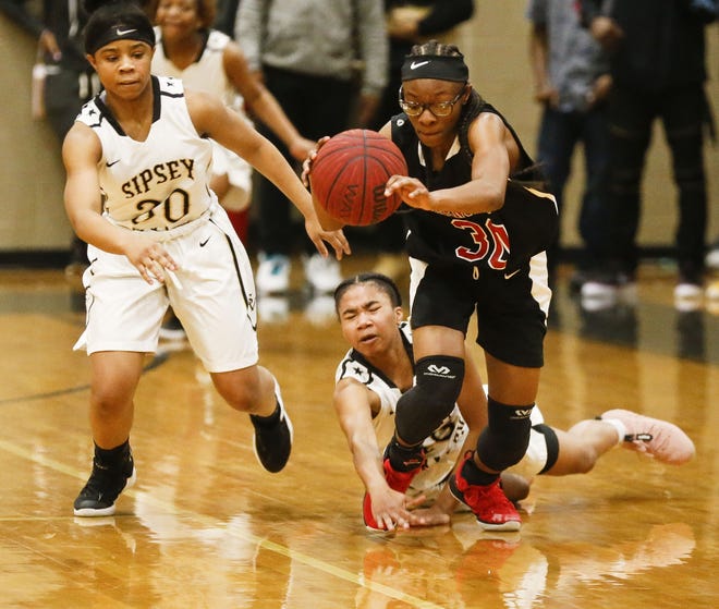 In this Feb. 12, 2019 photo, Greensboro guard Adriana Jones steals the ball from Sipsey Valley players Adasia Cash and Taylor Smith in a sub-region game. On Tuesday, Feb. 19, 2019 in Montgomery, the Greensboro girls defeated Hillcrest-Evergreen 68-28 to reach the Class 4A Southwest Regional finals. [Staff Photo/Gary Cosby Jr.]