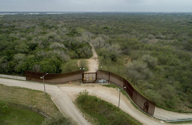 A gate in the border wall blocks access between the Old Hidalgo Pumphouse Museum and World Birding Center in Hidalgo and what is now unused parkland between the wall and the Rio Grande. U.S. Border Patrol has awarded a contract to a firm with Austin ties to build up to 11 new gates in Cameron County. [JAY JANNER/AMERICAN-STATESMAN]