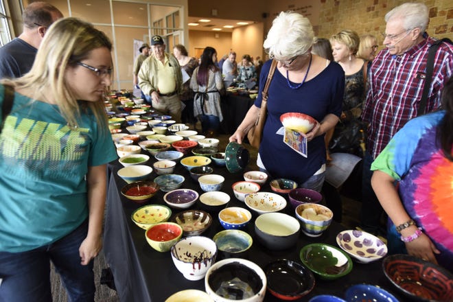 Attendees to the Empty Bowl Project fundraiser for the Bastrop County Emergency Food Pantry in February 2018 select from a colorful assortment of bowls in the Bastrop Convention Center lobby.

TERRY HAGERTY/ FOR BASTROP ADVERTISER