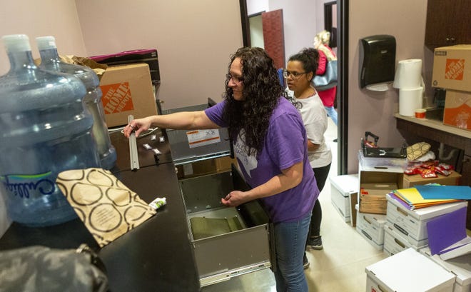 Office manager Sheri Turner, left, and patient advocate Stephanie Martinez assemble file cabinets Thursday in the new location of Whole Woman's Health of Austin, an abortion provider. The organization said it had to leave its previous location in North Austin after abortion opponents bought out its lease. [STEPHEN SPILLMAN / FOR STATESMAN]