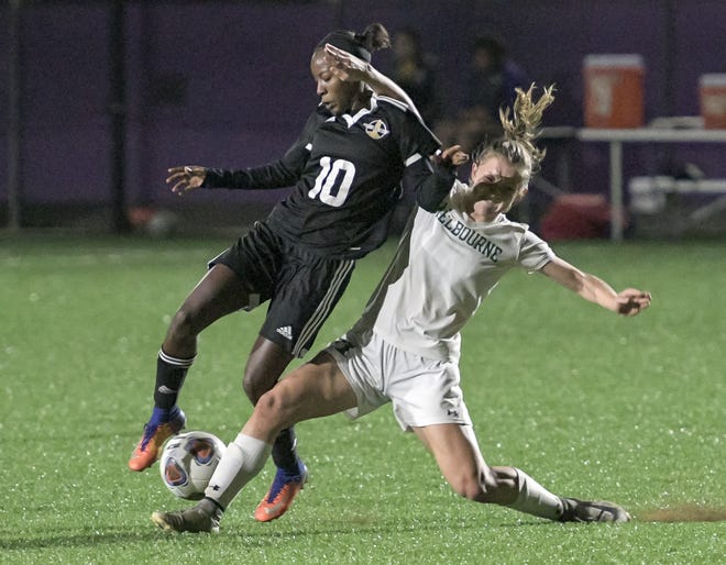 Montverde Academy's Jody Brown (10) battles for the ball during a regional quarterfinal against Melbourne on Feb. 5 in Montverde. Brown leads the Eagles with 31 goals this season. [PAUL RYAN / CORRESPONDENT]