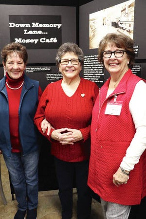 Sisters Marcia Millang of Story City, and Myrna Harmon and Elaine Raines, both of Slater, were the Gibson girls who all worked at Mosey’s Cafe in Slater when they were teens. They had fun listening in and sharing during a program about the historic cafe on Feb. 14 at the Heritage Hall in Slater. Photo by Marlys Barker