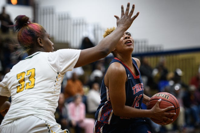 Pine Forest's Darian Everett covers Terry Sanford's Nyla Cooper during the first half of the semifinal of the girls' basketball Patriot 4-A/3-A Conference tournament on Thursday, Feb. 21, 2019, at E.E. Smith High School. [Andrew Craft/The Fayetteville Observer]