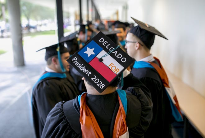 Estevan Delgado lines up for his graduation ceremony at the Lyndon B. Johnson School of Public Affairs at the University of Texas May 19. Some Texas Demographic Center projections show the state's Hispanic population will grow from the 37.6 percent of the population it was in 2010 to 55.6 percent in 2050. Over the same period, the state's non-Hispanic white share of the population will shrink from 45.3 percent to 21.8 percent. [JAY JANNER / AMERICAN-STATESMAN]