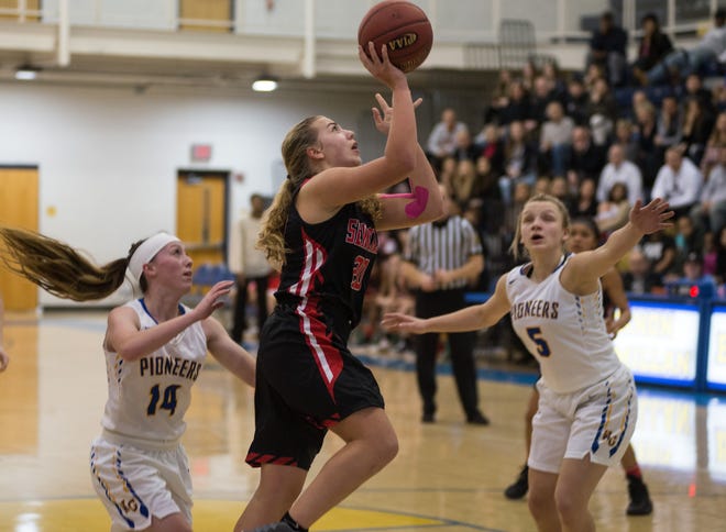 Sewickley Academy's Kamryn Lightcap drives to the basket during the Panthers' WPIAL Class 1A quarterfinal playoff game against West Greene Friday night at Canon-McMillan High School. [Andrew ChiappazziBCT Staff]