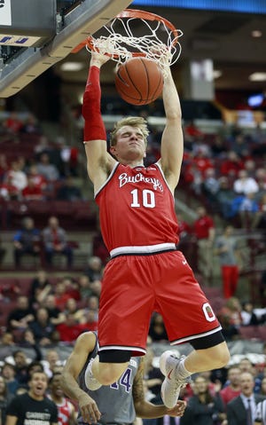 Justin Ahrens dunks against Northwestern on Wednesday, when he opened the second half in Ohio State's lineup. [Brooke LaValley/Dispatch]
