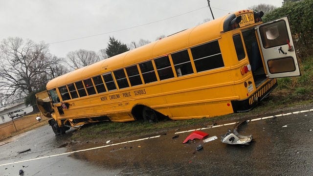 A yellow school bus wrecked around 3:45 p.m. Friday near the 5100 Block of Dallas-High Shoals Highway in Gaston County. [WSOC-TV/SPECIAL TO THE GASTON GAZETTE]