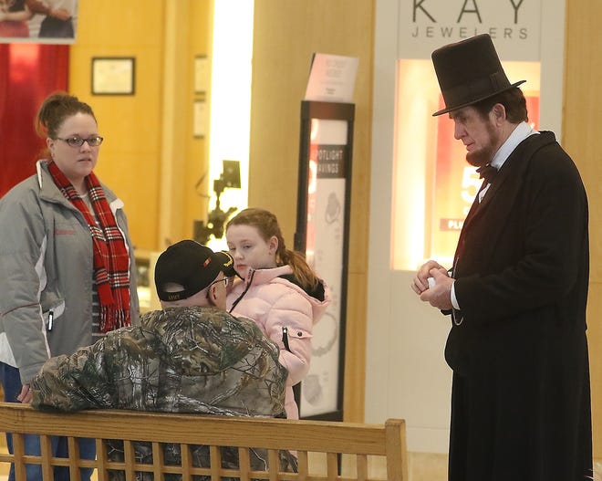 Abraham Lincoln talks with visitors to the T-County Patriot Rally Feb. 16 at the New Towne Mall. (TimesReporter.com / Jim Cummings)
