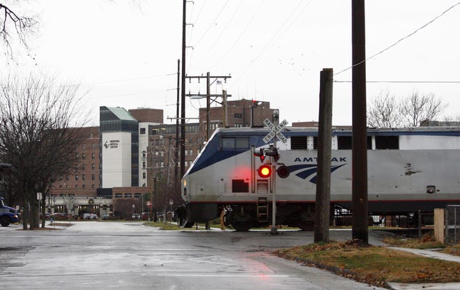 An Amtrak passenger train crosses Union Street just a few blocks away from Memorial Medical Center in 2011.