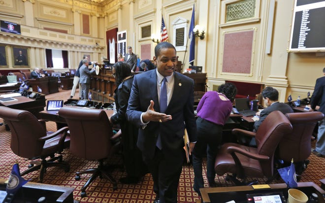 Virginia Lt. Gov. Justin Fairfax exits the floor after the Senate adjourned their 2019 session at the Capitol in Richmond, Va., Sunday, Feb. 24, 2019. Fairfax delivered an impassioned speech and said "If we go backwards and we rush to judgment and we allow for political lynchings without any due process, any facts, any evidence being heard, then I think we do a disservice to this very body in which we all serve." (AP Photo/Steve Helber)