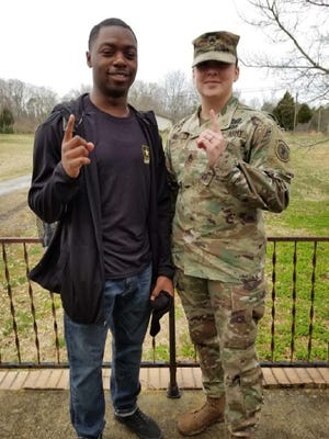 Ja'Quavion Linder poses with his recruiter Staff Sgt. Casey Raza before shipping off to basic training. [Special to The Star]