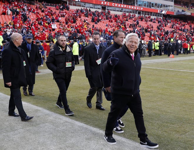 New England Patriots owner Robert Kraft, right, arrives on the field before the AFC Championship game in Kansas City, Mo on Jan. 20. Kraft visited a Florida massage parlor for sex acts on the morning of the game. It was his second visit to the parlor in less than 24 hours, according to documents released by the Palm Beach State Attorney's Office Monday afternoon. [File photo / The Associated Press]