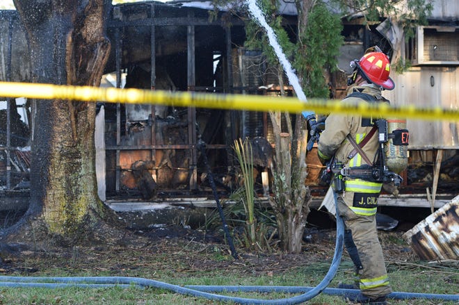 This mobile home was destroyed by fire in Dona Vista, just south of Umatilla. Fire officials now say it probably isn't related to the string of arsons in the Umatilla area over the last 10 days. [Whitney Lehnecker/Daily Commercial]