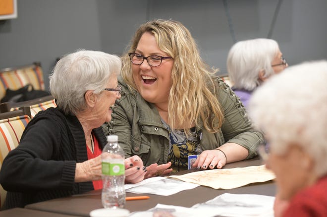 LESLIE RENKEN/JOURNAL STAR Jane Moldenhauer, 86, and Methodist College nursing student Grace Gerding share a laugh while making art at Heartis Village last week.