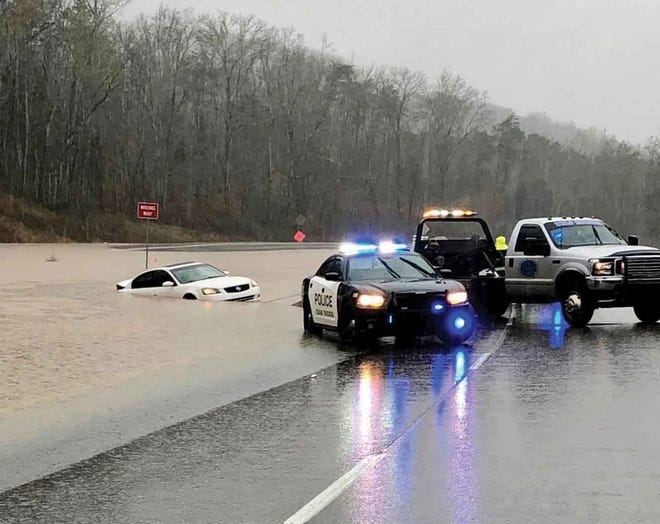 The Oak Ridge Turnpike/Highway 95 closed Saturday because of flooding, but some drivers tried to make it through the water — which emergency personnel warn against.